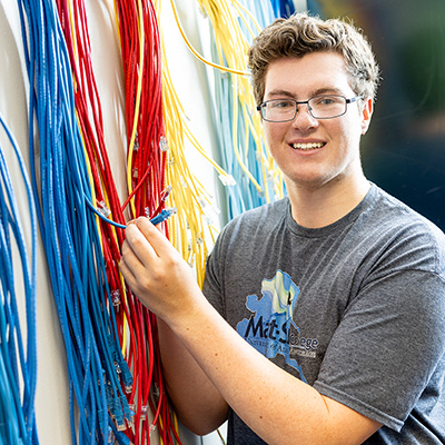 Man with computer cables