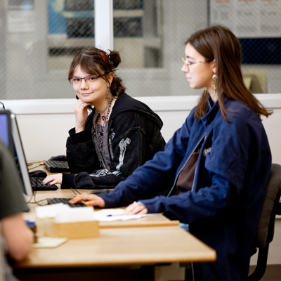 Girls in library at computer
